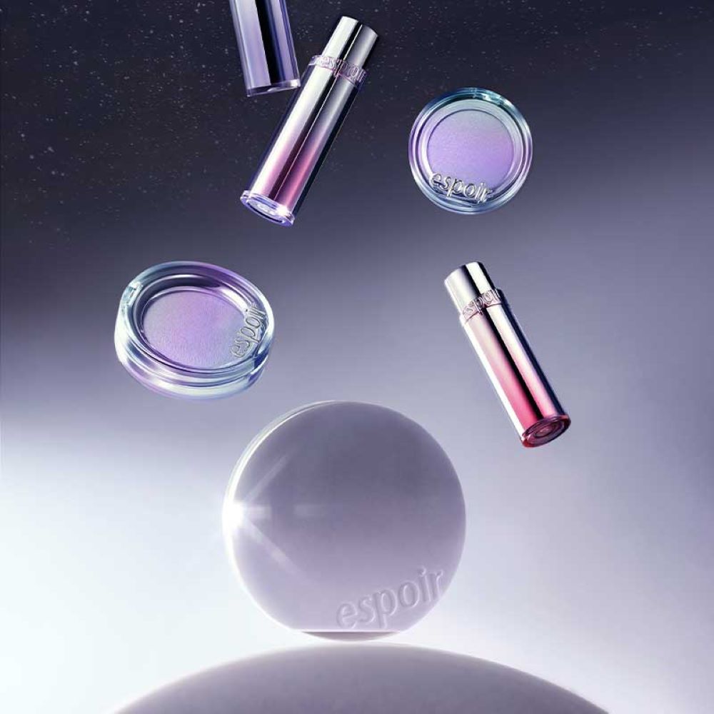 ESPOIR New Galaxy Edition Cushion / Highlither / Lipstick / Lip balm in a cosmic setting with colorful packaging.