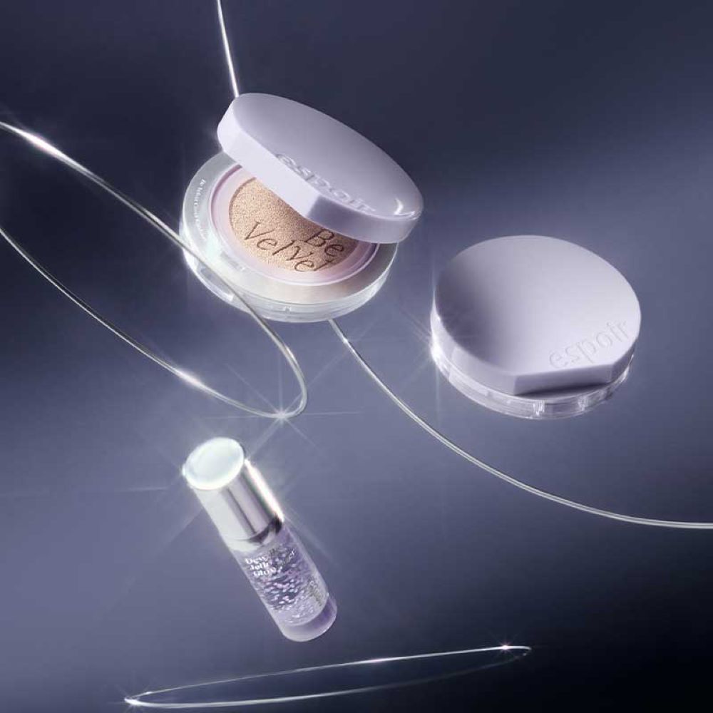 ESPOIR New Galaxy Edition Cushion / Highlither / Lipstick / Lip balm displayed elegantly against a reflective backdrop.