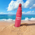ETUDE marker tint on a sandy beach with ocean and blue sky in the background