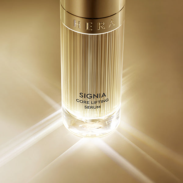 HERA Signia Core Lifting Serum 50ml displayed in illuminated setting, showcasing its intensive firming properties.