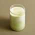 Osulloc Matcah Mania Bundle matcha drink in a clear glass with layered green and white hues.